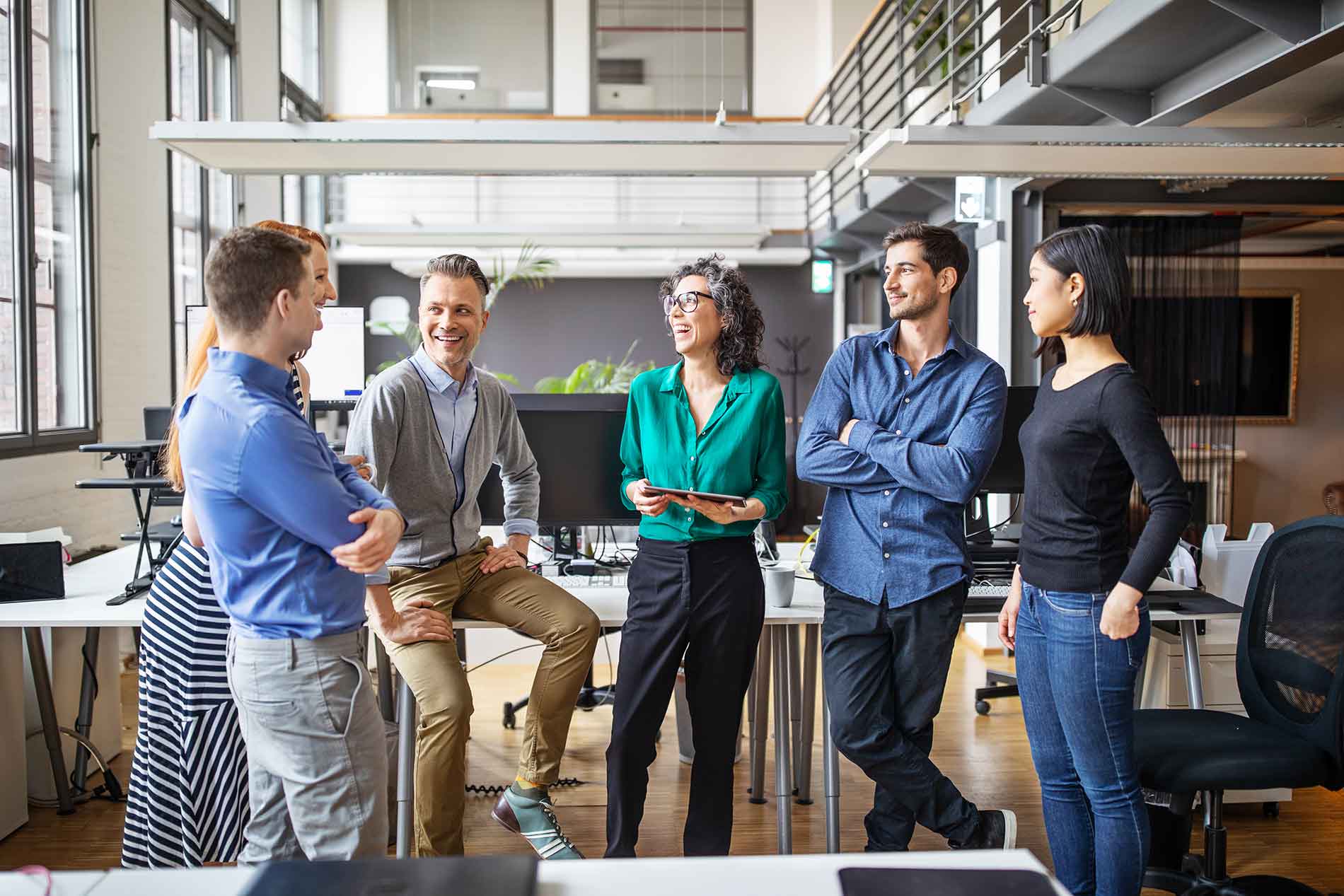 Group of co-workers enjoying a laugh.