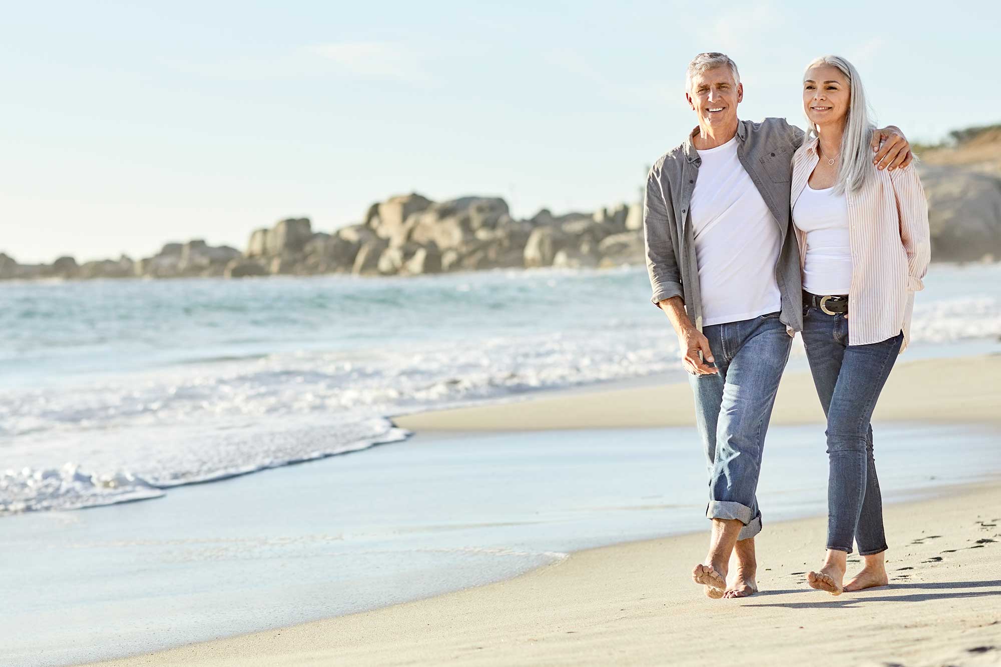 Couple walking along the beach